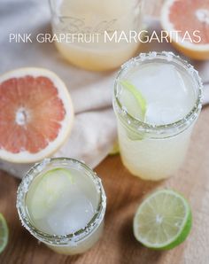 pink grapefruit margaritas are garnished with lime and served in glasses