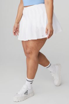 Pleated perfection. This out-and-about must-have is ready to take the win on the court or in the streets, thanks to a comfy inner short with hidden pocket, lightweight feel and sweet pleats all the way around. Casual Spring Sports Pleated Skirt, Sporty Stretch Tennis Skirt With Pleated Waist, Sporty Summer Tennis Skirt With Pleated Waist, Sporty Pleated Skirted Bottoms, Sporty Pleated Tennis Skirt For Summer, Casual Stretch Pleated Sports Skirt, Casual Stretch Pleated Skirt For Sports, Casual Pleated Skirt For Sports In Summer, Casual Summer Pleated Skirt For Sports