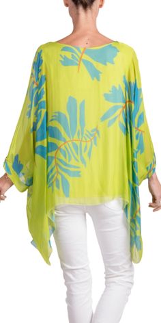 100% Silk Kaftan Style Blouse with Large Leaf Print. Features 3/4 Length Sleeves and a Wavy Bottom. Exterior: 100% Silk Interior: 95% Viscose, 5% Elastic Fits Sizes XS- XL Made in Italy Green Tunic Cover-up For Spring, Spring Green Tunic Cover-up, Green Spring Tunic Cover-up, Beach Viscose Tunic, Spring Beach Viscose Tunic, Spring Beach Tunic Made Of Viscose, Summer Beach Tunic In Viscose, Flowy Top For Beach Cover-up In Spring, Green Viscose Tops For Vacation