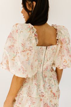 this vintage-inspired puff sleeve midi dress is a zoco hunny essential. featuring a soft spring floral pattern with a slimming smocked bodice + dreamy puff sleeves, it’s the perfect formal dress for brunch dates, garden parties, + bridal showers. pink + sage floral // midi length, square neck, smocked, puff sleeve, pockets, back zipper, fully lined, organza model is 5'8" + wearing a small measurements are approximate + taken while laying flat small : bust 34” (smocked) length 48” medium : bust 3 Dress For Brunch, Puff Sleeve Midi Dress, Soft Spring, Brunch Dates, Puff Sleeve Dress, Garden Parties, Dress Spring, Puffed Sleeves Dress, Sleeve Midi Dress