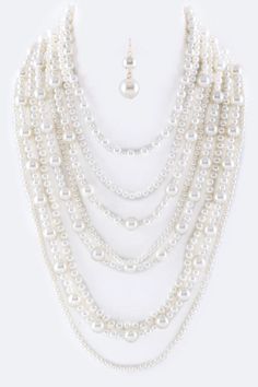 Enhance your everyday look with the stunning Million Pearls Layer Necklace Set. With layers of lustrous pearls, this set adds elegance and sophistication to any outfit. The perfect accessory for a night out or a special occasion. Elevate your style and make a statement with this beautiful necklace set. SPECIFICATIONS: Necklace - 17" + Extension Earrings - 1.85" Drop Lead & Nickel Compliant Layered Necklace Set, Layer Necklace, Gold Necklace Set, Beautiful Necklace, Fashion Set, Cream White, Layered Necklaces, Everyday Look, Beautiful Necklaces