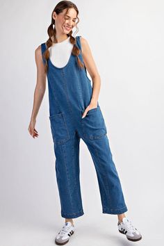 Mineral washed solid sleeveless jumpsuit featuring adjustable straps, a scoop neckline, two open front pockets and is a straight leg style. Model is 5'9" and wearing a small.75%COTTON 23%POLYESTER 2%SPANDEX Spring Medium Wash Overalls With Adjustable Straps, Trendy Overalls With Adjustable Straps, Summer Medium Wash Overalls With Adjustable Straps, Medium Wash Overalls With Adjustable Straps For Summer, Summer Overalls With Adjustable Straps In Medium Wash, Relaxed Fit Overalls With Adjustable Straps For Spring, Spring Overalls With Adjustable Straps In Relaxed Fit, Spring Overalls With Adjustable Straps And Relaxed Fit, Spring Casual Jumpsuits And Rompers With Adjustable Straps