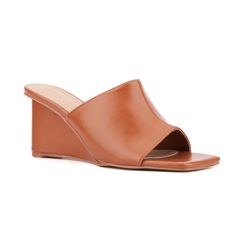 Whether you're heading out for a night on the town or enjoying brunch with friends, the Candie has you covered. This open-toe mule features a chic wedge that combines style with comfort, making it perfect for all-day wear. The versatile design effortlessly complements any outfit, ensuring you look fashionable from day to night. With its blend of elegance and practicality, the Candie is a must-have addition to your wardrobe, offering both sophistication and ease for any occasion. Cheap Brown Wedge Heel Mules, Modern Leather Wedge Sandals With 4-inch Heel, Leather Wedge Mules With 4-inch Heel, Brown Wedge Sandals With Heel Strap, Medium Width, Ankle Strap Chunky Heels, Wide Width Sandals, Brown Synthetic Wedge Sandals With 4-inch Heel, Kitten Heel Sandals, Faux Leather Heels