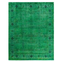 a green rug with an intricate design on the top and bottom, in different colors