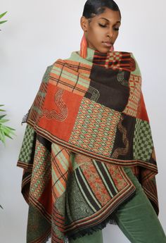 This gorgeous shawl is all about color. It features a beautiful ethnic inspired motif and features beautifully shades of green, orange and brown. One Size Fits All Brown Bohemian Shawl For Fall, Fall Bohemian Pashmina Shawl In One Size, Bohemian Fall Shawl Dupatta, Brown Pashmina Shawl For Fall, Bohemian Green Pashmina Shawl, Green Bohemian Pashmina Shawl, Bohemian Pashmina Shawl For Fall, Green Shawl Poncho For Fall, Bohemian Green Pashmina Dupatta