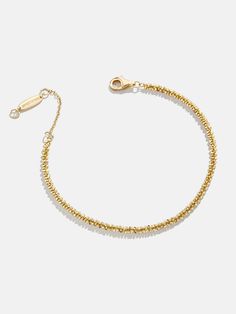 When it comes to the Avery 18K Gold Bracelet, less is more. A single 18K gold chain makes a statement and creates texture to revitalize your go-to look. Adjust the clasp to create your perfect fit and see how even simple styles can make an impression. Timeless 14k Gold Chain Bracelet With Spring Ring Clasp, Everyday 14k Gold Bracelet With Spring Ring Clasp, Elegant Gold Bracelet With Box Chain, Yellow Gold Plated Chain Bracelet With Spring Ring Clasp, Elegant Matte Gold Tarnish-resistant Bracelets, Gold Plated Yellow Gold Chain Bracelet, Classic Yellow Gold Bracelet In Recycled Gold, Dainty Yellow Gold Bracelet With Solid Link Construction, Dainty Yellow Gold Bracelet With Solid Links