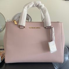 Brand New Never Used Michael Kors Soft Pink Handbag/Satchel. Comes With Strap That Can Convert Purse To Satchel. No Defects. Tag Still Attached. Perfect Condition. Stuffing Still Inside! Pink Handbag, Bags Michael Kors, Pink Handbags, Fancy Bags, New Handbags, Michael Kors Bag, Kate Spade Top Handle Bag, Summer Collection, Soft Pink