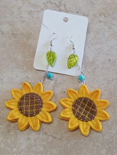 Sunflower Dangle w/Leaves Earrings Bohemian Sunflower Drop Earrings, Bohemian Yellow Sunflower Earrings, Yellow Sunflower Dangle Earrings, Yellow Sunflower Design Dangle Earrings, Sunflower Dangle Earrings For Summer, Summer Flower Earrings With Sunflower Design, Yellow Sunflower Design Earrings For Summer, Summer Sunflower Design Earrings, Nickel-free Flower Drop Earrings For Summer