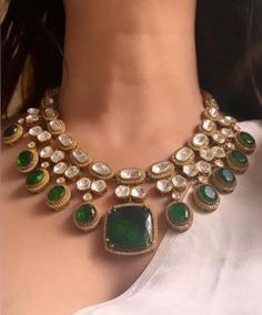 Introducing our exquisite Gold Finish Emerald Green Doublet Stones  Kundan Wedding Jewelry Necklace Set, inspired by the timeless elegance of Sabyasachi jewelry. Necklace length:15-16"  Adjustable length with a golden zari dori at the back  Necklace width-11" Pendant length and width 1"  This stunning set features meticulously crafted emerald green doublet stones, uncut moissanite, and intricate polki kundan work, all set in a luxurious gold finish. Perfect for a bride or anyone looking to make Engagement Lengha, Golden Jewelry Necklace, Green Necklace Set, Wedding Jewelry Necklace, Sabyasachi Jewelry, Unique Wedding Jewelry, Kundan Work, Gold Backdrop, Artificial Jewelry