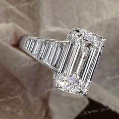 Handmade 9 CT emerald cut moissanite engagement ring,14k white gold Angelina jolie luxury celebrity style huge large emerald cut engagement ring,wedding ring,anniversary ring gift for women her → Occasions: Engagement & Wedding DESCRIPTION  -------------------- STYLE                :Solitaire / eternity /shank  ●𝐂𝐞𝐧𝐭𝐞𝐫 𝐒𝐭𝐨𝐧𝐞 𝐃𝐞𝐭𝐚𝐢𝐥𝐬 →Stone Type      :Moissanite - High Quality →Main Stone      :Emerald →Size (mm)        :14*10 →Carat Weight   :9  ●𝐌𝐚𝐢𝐧 𝐬𝐭𝐨𝐧𝐞 𝐨𝐩𝐭𝐢𝐨? 5ct Engagement Ring, Emerald Cut Moissanite Engagement Ring, Emerald Cut Engagement Ring, Plus Size Rings, Emerald Cut Engagement, Emerald Cut Moissanite, Emerald Engagement Ring Cut, Etsy Wedding Rings, Emerald Engagement