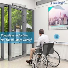 a man in a wheel chair sitting next to a glass wall with the words touchless induction and no touch, more safety