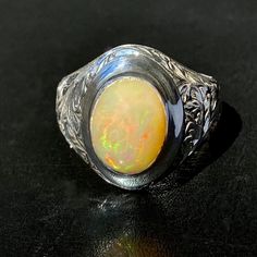 925 STERLING SILVER MEN'S RING WITH NATURAL OPAL Quality meets perfection Handcrafted by Turkish artisan jewelers Unique collectors item METAL : .925 Sterling Silver GEMSTONE: Opal (origin: Africa) DIMENSIONS OF STONES: 10x14 mm SIZE: US 10 Spiritual Hallmarked Signet Ring For Formal Occasions, Opal Rings With Polished Finish For Formal Occasions, Formal Opal Rings With Polished Finish, Spiritual White Gold Rings For Formal Occasions, Classic Opal Jewelry With Polished Finish, Classic Opal Ring Collectible, Classic Formal Opal Rings, Heirloom Oval Opal Ring With Polished Finish, Untreated White Gold Jewelry For Formal Occasions