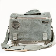 This Messenger Bag is  made of original truck and military canvas. - heavy duty cotton - all weather resistant - unique in detailing and shade of canvas - light and durable    Features   - 1 large zippered interior compartment - cotton lining with key/phone zip pocket - small outer pockets for phone, pencils etc. - 1 big zippered outer pocket - 1 flap zip pocket - adjustable strap with shoulder pad Measurements: 39x26x11cm   Every piece of canvas is original, giving each bag a unique design. Canvas Messenger Bag, Bags Aesthetic, Canvas Shoulder Bag, Cute Bags, Casual Bags, Shoulder Pads, Bag Sale, Purses And Handbags, Camera Bag