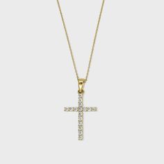 A solid gold Cross adorned with natural diamonds. Gold Pendant Cross Necklace With Diamond Cut, Brilliant Cut Diamond Cross Pendant Jewelry, 14k Gold Cross Pendant With Diamond Cut, Yellow Gold Diamond Cut Cross Pendant, Diamond Circle Pendant, 14k Gold Diamond-cut Cross Pendant, Circle Diamond, Diamond Cross, Diamond Cross Pendants