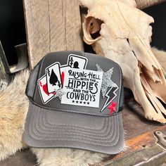 Raising Hell with the Hippies Grey & Black Custom Trucker Hat Custom Trucker Hat Ideas, Patch Trucker Hat Ideas, Custom Trucker Hats Patches, Trucker Hat Bar, Western Trucker Hats, Trucker Hats, Western Snapback Trucker Hat For Country Events, Western Trucker Hat With Leather Patch, Country Style Trucker Hat For Western-themed Events