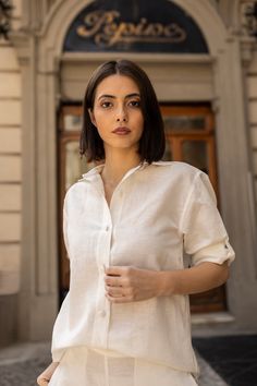 The Mary Shirt is our take on the classic button-down shirt. A dependable staple you'll return to season after season. It's cut for an oversize fit, from a lightweight cotton-linen blend and designed with dropped shoulders, long sleeves with fabric covered button cuffs and a curved hem. Cashmere Cape, Linen Shirts Women, Linen Dress Women, Capes For Women, Fabric Covered Button, Knitting Accessories, Blouse Patterns, Linen Women, Teal Green