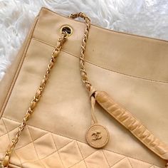 Authentic Beige/Tan Chanel Cc Lambskin Tote Purse My Mom Originally Paid 2,500 For This Purse A Few Years Back. Condition: The Bag Is In Fair Condition. There Are No Major Flaws, All Hardware Is Working. It Also Still Has The Keychain Attached Which Is Worth 200 On Its Own. The Bad Does Have Some Scratches And Marks On The Outside And Interior, But Some Leather Polish/ A Visit To A Leather Clinic Would Fix Those Small Marks. This Bag Is Originally 2,500 Dollars And Is In Good Condition, Please No Super Low Balls. Lowest I Will Accept Is ~500 Dollars 500 Dollars, Chanel Bags, Tote Purse, The Bad, Chanel Bag, Limited Time, The Bag, Chanel, Bag Lady