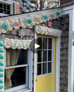 a house decorated for christmas with snowflakes and candy canes