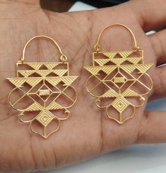 18k Solid Gold Handmade and Handcraftet Dangling Geometric Hoops, Dangling Bell decorated with Mutiple Triangles in Rajasthani Art way. Rajasthani Gold Jewelry, Indian Gold Dangling Hoops, Big Gold Hoops * Metal: 18k Solid Gold ( Hallmarked ) * Pure and Genuine 18k Gold ( Hallmarked ) * Weight: 20 Gram ( approx) * Wide: 42mm * Total Length: 46mm long One of a kind amazing Gold Hoops with Rajasthan Art In Various Triangle on it in . We welcome custom orders as well. Gold jewelry comes in gift box Festive Designer Jewelry With Intricate Design, Festive Gold Jewelry With Artistic Design, Wedding Jewelry With Artistic Gold Design, Artistic Design Gold Jewelry For Weddings, Wedding Gold Jewelry With Artistic Design, Designer Jewelry With Intricate Design For Gift, Gold Jewelry With Artistic Design For Festivals, Designer Cutdana Jewelry For Gifts, Unique Gold Jewelry For Festivals