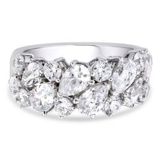 a white gold ring with three pear shaped diamonds on the sides and two rows of oval cut