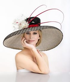 2019 spring collection. Large oversized off white hat covered with black mesh material . Adorned with hand made feather flower and quills. One of the kind. Was featured on a few news channels and runway shows. Limited edition Luxury Straw Hat For Formal Kentucky Derby, Luxury Vintage Top Hat For Kentucky Derby, Luxury Straw Hat For Kentucky Derby And Church, Luxury Flat Crown Top Hat For Kentucky Derby, Luxury Hats For Kentucky Derby, Luxury Ostrich Feather Hats For Spring, Luxury Formal Costume Hat With Pinched Crown, Luxury Brimmed Panama Hat For Kentucky Derby, Luxury Cowboy Hat For Kentucky Derby With Short Brim