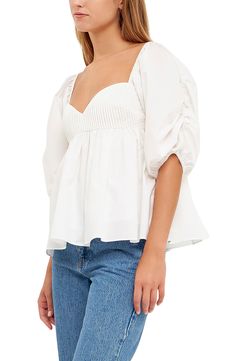 Puffed elbow-length sleeves frame this flouncy cotton blouse designed with a pintucked bodice and a smocked back. Sweetheart neck Elbow-length sleeves Partially lined 100% cotton Hand wash, dry flat Imported Blouse Designed, Cotton Blouse Design, English Factory, Modest Fits, Concert Looks, Jean Shirt Dress, Sweaters And Leggings, Sports Blazer, Cotton Blouse