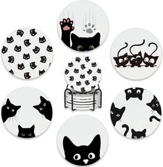 six black and white plates with cats on them