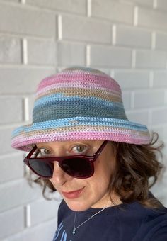 "Crochet bucket hat, knitted bucket hat, bucket hat for women, bucket hat for men, summer bucket hat, boho bucket hat, custom bucket hat This unisex crochet bucket hat is made with a premium cotton mix. It's a beautiful and stylish accesory for summer time; chic, soft and comfortable. It's a great sun visor in your daily use, at the beach and at fun places like summer festivals. The material is very soft and firm at the same time; fits very well and feels very comfortable on the head. It is so flexible that you can shape and use the brim differently as you wish. SIZE: S/M ------ * Circumference for head : 22-23 inches / 56-58.5 cm SHIPPING: -------------- * All the items in my shop goes with \"Free Shipment\" except some far away destinations. * I Usualy ship the ready items on following w Trendy Lightweight Bucket Hat With Short Brim, Pink Lightweight Brimmed Bucket Hat, Lightweight Pink Brimmed Bucket Hat, Casual Crochet Fedora Hat, Multicolor Lightweight Bucket Hat With Curved Brim, Lightweight Multicolor Bucket Hat With Curved Brim, Casual Curved Brim Cotton Sun Hat, Lightweight One Size Fits Most Bucket Hat, Casual Wide Brim Cloche Hat Handmade