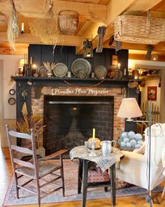 a living room filled with furniture and a fire place in front of a brick fireplace