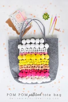 a tote bag made out of pom poms and cotton balls is shown