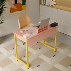 a pink desk with a laptop on it in front of a plant and bookshelf