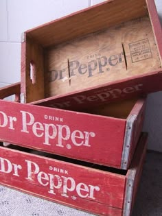 two red wooden boxes with dr pepper on them