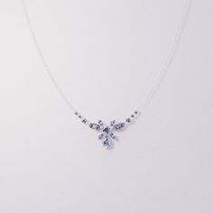 Introducing Blossom: Crafted as a romantic high-end floral necklace to complement any of our other pieces as a set or to shine brightly on it's own. This classical necklace is perfect for any occassion. As a gift for her, a supplement to an engagement ring or a gift for yourself - because you deserve it - it is guaranteed to impress. A bright and shiny string of simulated diamonds make this necklace stand out and is sure to bring lots of compliments. Each stone shines brightly to perfection and Elegant Crystal Jewelry For Mother's Day, Fine Jewelry White Necklaces With Sparkling Stones, Dainty Diamond White Flower Pendant Jewelry, Dainty Sparkling Necklace For Party, Elegant White Gold Flower Charm Necklace, Elegant Silver Bridal Necklace With Elegant Design, Silver Necklaces For Mother's Day Party, Elegant White Gold Flower Necklace, Delicate Diamond White Flower-shaped Jewelry