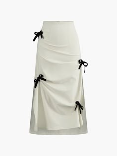 a white skirt with black bows on the side