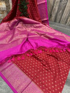 Festive soft cotton silk saree with Banarsi weaving. Gold zari butas with a contrast palla. -Matching blouse fabric included. -Fall attached  Note: The color of the products may slightly vary according to the lighting conditions and the color calibration of the viewing LED devices. If you would like more clarity before your purchase, please drop us a message . Red Saree With Cutdana For Diwali, Red Art Silk Pre-draped Saree With Self Design, Red Pre-draped Saree With Zari Weaving, Diwali Cotton Silk Saree With Pallu, Festive Red Saree With Self Design, Red Anarkali Blouse In Slub Silk, Red Cotton Silk Dupatta With Zari Work, Red Handloom Tussar Silk Lehenga, Red Cotton Silk Dupatta With Traditional Drape