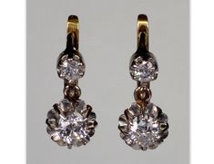 A splendid pair of French 18K gold platinum diamond earrings from Edwardian period C.1900. The earrings measure 12 mm high 6 mm wide. The diamonds are old European cut.   The bottom ones measure 3.5 mm diameter or 0.15 Ct.   The top diamonds are 2.5 mm or 0.05 Ct. They are E in color scale and their clarity is VS1/VS2. The diamonds are set in platinum. The back of the earrings and the lever back clasps are 18K gold. The earrings are hallmarked with eagle - the French stamp for 18K gold. Platinum Classic Hallmarked Yellow Gold Diamond Earrings, Classic Hallmarked Diamond Earrings For Formal Occasions, Classic Hallmarked Diamond Earrings For Formal Events, Vintage Gold Diamond Earrings With Brilliant Cut, Victorian Brilliant Cut Diamond Earrings For Anniversary, Victorian Diamond Earrings With Prong Setting For Anniversary, Classic Diamond Drop Earrings With 17 Jewels, Victorian Style Round Diamond Earrings For Formal Occasions, Vintage Hallmarked Diamond Earrings