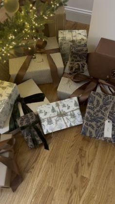 many wrapped presents under a christmas tree