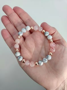 Absolutely stunning! This gorgeous gemstone bracelet features natural Rose Quartz, White Howlite and Rose Gold Hematite beads.  Beads are 8mm and 4mm. Bracelet stretches to fit. Coral Beaded Bracelets, Natural Bead Bracelets, Natural Gemstone Bracelets, Natural Beads Bracelet, Stone Beads Bracelets, Glass Bead Ideas, Crystal Bead Bracelet Ideas, Stone Bracelet Ideas, Bracelet Images