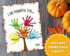 a thanksgiving card with handprints on it next to pumpkins