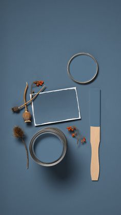 the supplies needed to make this craft include scissors, tape, and other items on a blue background