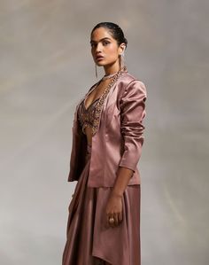 Editor's Note Style a traditional look with a solid lapel jacket with hand embroidery detailing Note: Blouse and skirt worn by model is for styling purposes only. Color: Mauve Fabric: Heavy Satin Fit type: Tailored Components: Jacket Occasion: Party Care: Dry Clean Only About the Designer The crux and essence of the label, Divya Aggarwal, is to challenge and revamp the face of ordinary traditional wear while being customer oriented. Driven by the values of individuality and creativity, this cont Floral Embroidery Lehenga For Evening, Floral Embroidered Lehenga For Evening, Elegant Party Outerwear With Traditional Drape, Elegant Traditional Drape Outerwear For Party, Formal Nehru Jacket With Floral Embroidery, Fitted Front Open Embroidered Lehenga, Evening Lehenga With Floral Embroidery And Fitted Style, Fitted Lehenga With Floral Embroidery For Evening, Elegant Bandhgala With Floral Embroidery And Traditional Drape