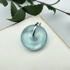 "Aquamarine Gemstone Pendant ,Donuts Aquamarine ,Silver 925 Pendant ,Gift, Cord necklace Pendant Size: 30 x 9mm Beads: 15mm Legend, Aquamarine is produced at the bottom of the sea, is the essence of the sea water, so sailors use it to pray for the sea god bless navigation safety, called it \"blessing god stone\". and is the birthstone for March. natural stone may have inclusions, natural lines or indentations.This is normal and part of the natural material." Modern Clear Round Jewelry, Clear Round Beads Jewelry Gift, Clear Round Beads Jewelry For Gifts, Aquamarine Round Pendant Jewelry For Gift, Sapphire Rondelle Jewelry Gift, Sapphire Rondelle Jewelry For Gift, Aquamarine Rondelle Jewelry Gift, Aquamarine Rondelle Jewelry As A Gift, Aquamarine Rondelle Jewelry For Gift