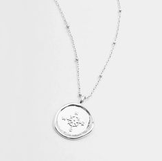 Gorjana's design with the aesthetic of a found object, this unique coin necklace has the feel of a family heirloom. This coin charm centers on an ever-so-dainty ball chain that effortlessly elevates your layered look. Chain extends out to 19" Coin is 3/4" across Spring ring closure Silver plated brass Lifetime manufacturer's warranty Avoid contact with anything containing derivatives of alcohol Coin Necklace Silver, Gorjana Necklace, Gorjana Jewelry, Silver Coin Necklace, Gold Coin Necklace, Travel Capsule, Silver Coin, Coin Necklace, Family Heirloom