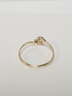 "Thanks for shopping our vintage estate store. We tend to sell well below wholesale and truly hope you enjoy all of our items. Many of the items are one of a kind, so please enjoy scrolling through the pictures and hopefully something will catch your eye. Black spots are from camera or reflections. Estate 10k yellow gold heart cz .05ct diamond ring. Ring size: 7.5 Setting: 4mm 1/4\" Band width: 1.5mm Weight: .86 gram Nice petite ring without the high cost. Marked 10k." Classic Gold Heart Ring With Brilliant Cut, Classic Heart Ring With Diamond Cut For Formal Occasions, Classic 14k Gold Heart Ring With Diamond Cut, Classic Heart Ring In Yellow Gold With Diamond Cut, Classic Heart Diamond Cut Ring For Formal Occasions, Classic Gold Diamond Heart Ring, Classic Yellow Gold Heart Ring With Diamond Cut, Classic 14k Gold Heart Ring With Single Diamond, Classic 14k Heart Cut Diamond Ring