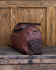 This one-of-a kind weekender bag features a vintage rug textile with mahogany glove-tan leather. It is perfect for your next getaway. Includes a long shoulder strap for easy carrying. Dimensions: 21" x 8.5" x 12" Item sold out? Custom orders are available! Inquire via email at: orders@crossbowleather.com Handmade by Crossbow in the mountains of Telluride, CO. Crossbow, In The Mountains, Weekender Bag, Tan Leather, Vintage Rug, Leather Bag, Vintage Rugs, Shoulder Strap, Rug