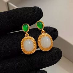 Expertly crafted with 24K gold-plated brass, these Elegant Hoop Earrings feature beautiful natural green and white chalcedony stones. The perfect mix of luxury and earthy beauty, each earring weighs only 1.86g, making them comfortable to wear. Add a touch of sophistication to any outfit with our Missy Jewelry Natural Stone Earrings Collection. Details Material: 24K gold-plated brass + Natural green chalcedony + Natural White chalcedony Color: Gold and green Size: Height 2.9cm, Width 1.25cm Weigh Earthy Beauty, Natural Stone Earrings, Chalcedony Stone, Green Chalcedony, Natural Stones Necklace, Pearl Jewelry Necklace, Gold Statement Earrings, Gold And Green, Natural Stone Jewelry