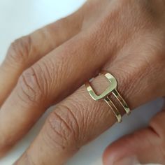 14K solid gold ring in a minimalist style for lovers of geometric shapes. ◈ DETAILS Weight: 3g Width upper part-9mm / 0.35'' Thickness-1.3 mm / 0.05'' ◈ MATERIAL 14K Solid Gold - Smooth,shiny,plain surface ◈ ALSO AVAILABLE IN 14K/18K/9K Yellow, Rose, or White Gold ◈ ENGRAVING is optional ◈ SHIPPING is insured express and free worldwide ◈ GIFT WRAPPING is included with every purchase ✧ Back to my shop for more handcrafted gold jewelry: https://etsy.me/38Cs5Zl If you have any questions, I will be Modern Everyday Stackable Rings With Open Band, Minimalist Recycled Gold Stackable Toe Rings, Minimalist Recycled Gold Open Band Ring, Modern Gold Stackable Initial Ring, Minimalist Stackable Rings With Open Band In Recycled Gold, Modern Stackable Rings As A Gift, Modern Stackable Rings As Gift, Modern Stackable Toe Rings For Gifts, Modern Stackable Rings