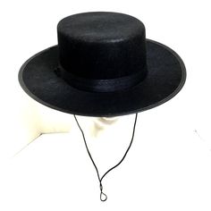 Zorro Classic Black Spanish Hat Zorro’s Hat Is A Signature Part Of His Look Complete Your Costume With Classic Hat Great For Many Costumes Spanish - Gaucho - Amish - Flat Top - Cinco De Mayo - Costume Hats Hat Comes With Chin Ties Black Satin Ribbon Hat Band 100% Polyester One Size Fits Most 23“ Diameter Flat - Wide Brim - 2 ¾” Crown 3.5” Black High Crown Felt Hat With Adjustable Fit, Black Brimmed Mini Hats For Rodeo, Black Mini Hats With Short Brim For Rodeo, Black Mini Hat With Short Brim For Rodeo, Black Wide Brim Costume Hat, Adjustable Black High Crown Boater Hat, Black Boater Hat With Short Brim For Rodeo, Black Boater Hat For Rodeo With Short Brim, Spanish Hat