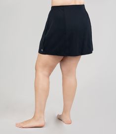 On land or in the sea, our AquaSport™ Swim Skirt Cover-up will give you the sporty style you're craving along with the performance you need. Wear over any one-piece swimsuit for a little added coverage, or create the perfect mix and match look by wearing it over our swim briefs and adding your favorite JunoActive swim top. Made with chlorine resistant fabric, this long lasting plus size swim skirt cover-up will see you through season after season. Imported. Please review the size chart below cre Black Swim Skirt With Built-in Shorts And 4-way Stretch, Black Swim Skirt For Sports In Summer, Black Summer Swim Skirt For Sports, Black Swim Skirt For Summer Sports, Sporty Swim Skirt With 4-way Stretch And Built-in Shorts, Black Athleisure Swim Skirt With Built-in Shorts, Sporty Moisture-wicking Swim Skirt For Poolside, Sporty Moisture-wicking Swim Skirt For Swimming, Fitted Black Moisture-wicking Swim Skirt