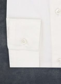 Featuring our premium basic white poplin shirt, the fixture for any wardrobe. Fashioned from the finest cotton and blended with spandex for optimal fit, and an intentional edge-stitch collar, this shirt is fabulously elegant in its simplicity. • Modern Fit • 98% Cotton 5% Spandex • Modern Collar • Modern Cuffs • Imported • LDS21-009 SIZE & FIT• Model is 5' 9" and wearing a size Small White Elegant Cotton Dress Shirt, Elegant White Cotton Dress Shirt, Classic Dress Shirt With Button Cuffs For Business Casual, Classic Fitted Cotton Shirt, Elegant Cotton Dress Shirt For Daywear, Elegant Solid Dress Shirt With Button Cuffs, White Elegant Shirt With Spread Collar, Elegant White Shirt With Spread Collar, Elegant Solid Dress Shirt For Business Casual